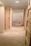 Hallway flooring laid, doors hung and trimwork complete
